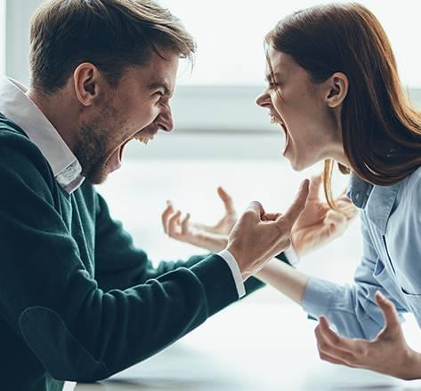 A person holding their head in frustration